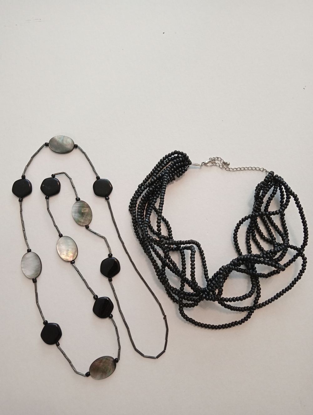 #1187.  2 Piece, Shell & Black Acrylic Multi Strand Necklace Bundle